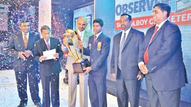 Flashback: Niroshan Dickwella of Trinity College (Schoolboy Cricketer of the Year 2012) receives his award from Chief Guest Marvan Atapattu. Also in the picture are Dinesh Weerawansa (Editor in Chief Sunday Observer), ANCL Chairman Bandula Padmakumara, Sports Minister Mahindananda Aluthgamage and SLT, Mobitel CEO Lalith de Silva