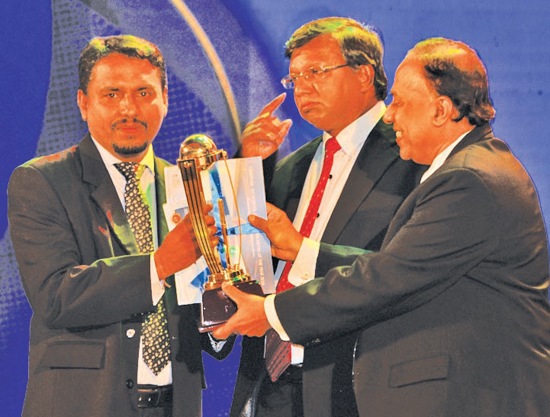 Division Three - Best Wicketkeeper – winner Ramuditha Disal of Vidyaloka College, Galle presented by Deputy General Manager/ Sales ANCL, R.S.N. Adhikari