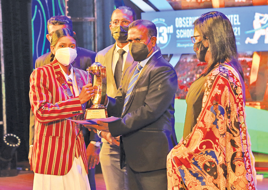 Nimesha Tharuni Wijesundera of Marapola Vidyalaya who won the Best Batswoman  Award is seen receiving the Award from General Secretary of the Association of Cricket Umpires and Scorers of Sri Lanka U.I.L.D. Wewage