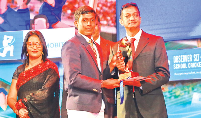 Division Two - Best Allrounder Tier A winner Vishwa Lahiru of Sri Sumangala College Panadura receiving the award from General Manager of ANCL Sumith Kothalawela. Also in the picture is Company Secretary of ANCL, Sudharshani Hewawasam.