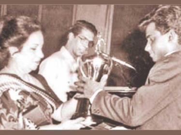 Flashback: Before conquering the Mount Everest of international cricket, young Sanath Jayasuriya received the Observer Schoolboy Cricketer of the Year Outstation award in 1988. He receives the trophy from Mrs. Malini Bodinagoda, wife of then ANCL Chairman Ranapala Bodinagoda, while compere Laddie Hettiarachchi looks on