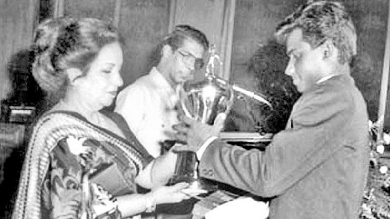 Flashback 1988: Before conquering the Mount Everest of international cricket, young Sanath Jayasuriya received the Observer Schoolboy Cricketer of the Year Outstation award in 1988. Here he receives the trophy from Malini Bodinagoda, wife of then ANCL Chairman Ranapala Bodinagoda while compere Laddie Hettiarachchi looks on