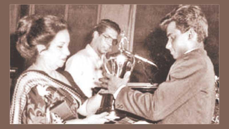 Flashback: Before conquering the Mount Everest of international cricket, young Sanath Jayasuriya received the Observer Schoolboy Cricketer of the Year Outstation award in 1988. He receives the trophy from Mrs. Malini Bodinagoda, wife of then ANCL Chairman Ranapala Bodinagoda, while compere Laddie Hettiarachchi looks on