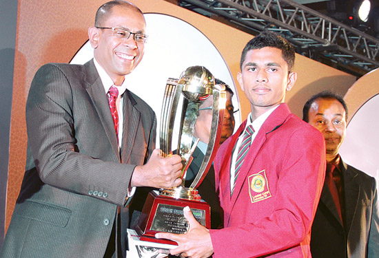 Best team Western Province. Captain of Lumbini College receiving the team award from Emeric Fernando, Director Finance ANCL.