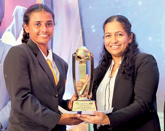 Best All-round Schoolgirl cricketer Harshitha Madavi form Anula Vidyalaya Nugegoda receives her award from Madara de Mel the Deputy General Manager Brand and Activation, Lake House