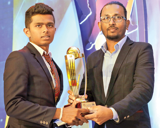 Raveen Yasas the winner of the Best Allrounder  Award in Division II receving his award from Kumara Gamhewage the General Manager of Batsman.com