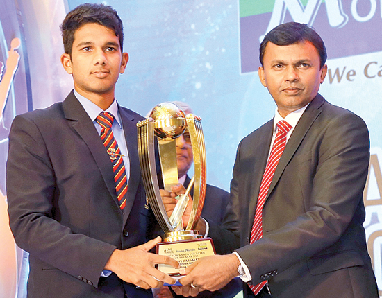 The best Batsman of the year Hasitha Boyagoda, Trinity College being Awarded the Trophy by Director Finance Lake House  Dushyantha Basnayake