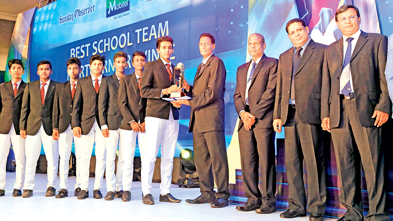 Skipper of St. John’s College Jaffna receiving the Best Team Award for the Nothern Province from Saadi Thawfeeq Group Sports Editor for English Papers- ANCL