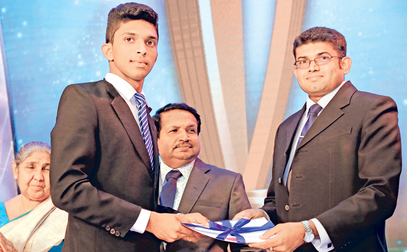 Division II Best Bowler runner up Chathura Jayanath Debarawewa National School being presented with his Certificate by Suranga Dalugoda Manager Advertising ANCL  