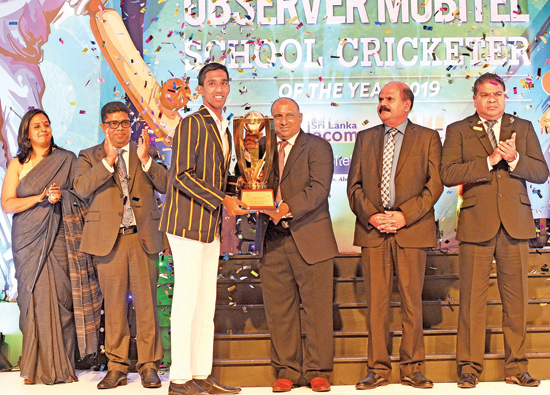 Observer Mobitel School Cricketer of the Year 2019 Chief Guest Aravinda de Silva handing over the Schoolboy Cricketer of the Year Award to Kamil Mishara of Royal College. Also pictured on stage are Krishantha Cooray (Chairman Lake House), Nalin Perera (CEO Mobitel) and Kumarasinghe Sirisena (Group Chairman SLT). (Pic: Ishara S. Kodikara)