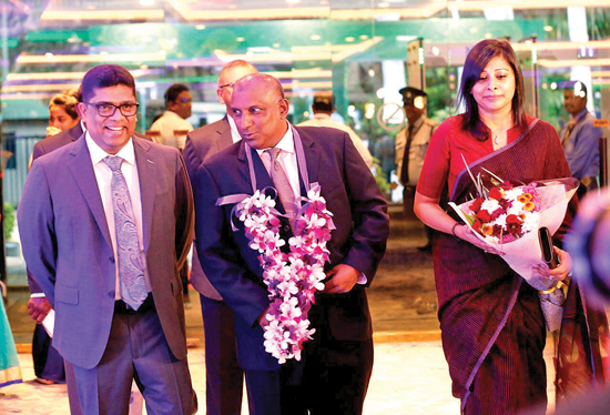 Aravinda de Silva and his wife being escorted on his arrival by Krishantha Cooray (Chairman ANCL)