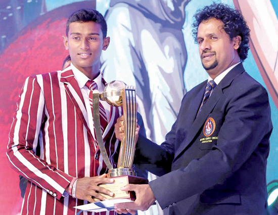 Nalanda College’s Best All-rounder Lakshitha Munasinghe receiving his award from Dilshan de Silva the secretary of the SLSCA