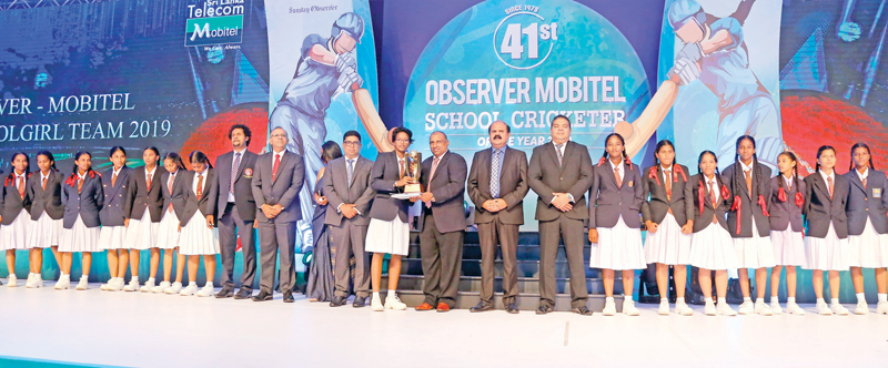 Devapathiraja Vidyalaya Ambalangoda, the Best Girls Team, pose with their trophy presented by Aravinda de Silva