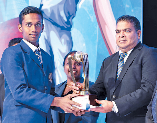 Winner of Division III Most Popular Cricketer of the Year 2019 YAD Sandaruwan of Galahitiyawa Central receiving the coveted Award  