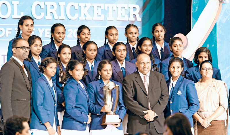 Emerging School Girls team Holy Cross College Gampaha with chief guest Aravinda de Silva