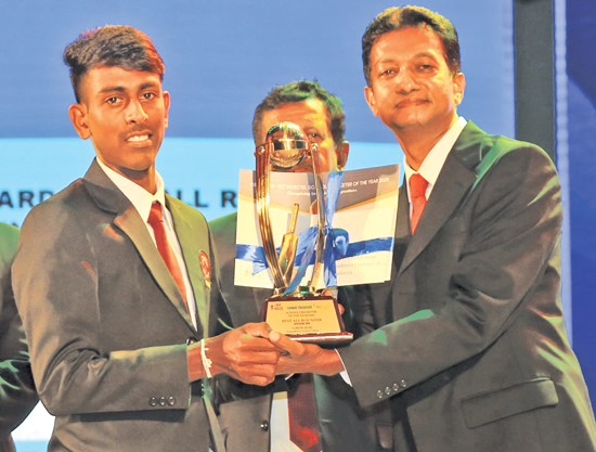 Division Two Best All-rounder Samith  Isuru of Karandeniya Central College is presented with his award from Acting General Manager of ANCL Sumith Kotalawela