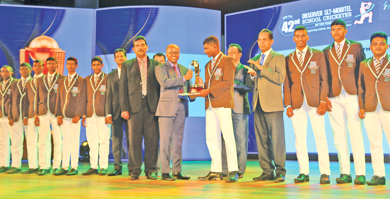Captain of the Best School Team of the Southern Province St. Thomas College, Matara is presented with their award given by ANCL Director Operations, Canishka Witharana