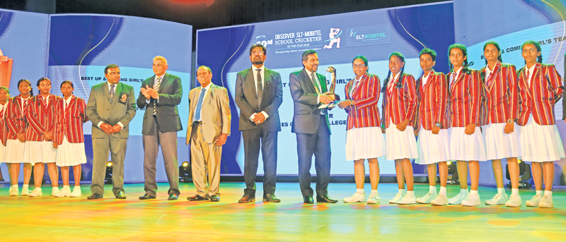 Best up-and-coming girls school team of the year 2020 Princess of Wales College Moratuwa receive their trophy from the Secretary to the Ministry of Media Jagath P Wijeweera in the presence of Media Minister Keheliya Rambukwella, Group Chairman of Sri Lanka Telecom Rohan Fernando, ANCL Chairman W Dayaratne PC and Editor in Chief Sunday Observer Dinesh Weerawansa