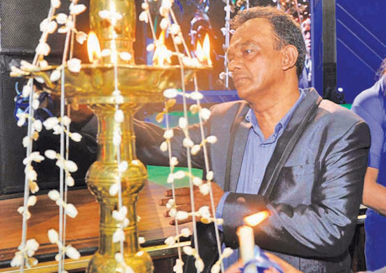 Lighting of the traditional oil lamp by  Director Editorial Dharma Sri Kariyawasam