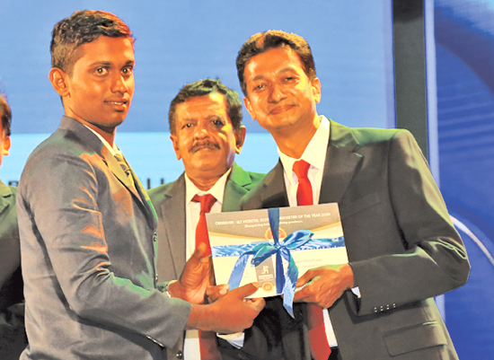 Awards Best All Rounder - Division Two - Runner up Sandaruwan Chinthaka of Galahitiyawa Central College receives the Award from Acting General Manager of ANCL, Sumith Kothalawela