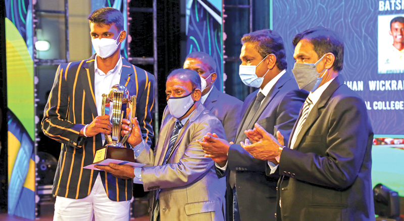 National Award for the best Batsman winner Ahan Wickramsinghe of Royal College receiving the Award from Chairman ANCL, W. Dayaratne Presidents Council