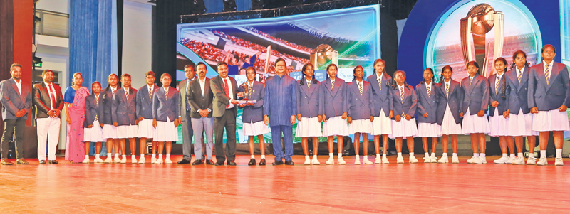 Best up and coming Girls School team of the country Sri Siddhartha Central College Eppawala receiving the Trophy from Secretary to the Ministry of Mass Media and Chairman and Managing Director ANCL Anusha Palpita