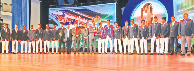 Director Legal and Administration ANCL Janaka Ranatunga presenting the award to Trinity College Kandy skipper the Best team from Central Province.