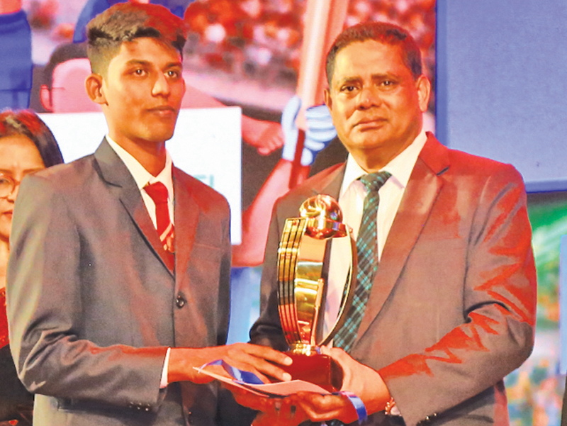 Division Two Tier B - Best Fielder Waruna Udara of St. Mary’s College, Kegalle being awarded the Trophy by Additional General Manger ANCL Virajith Bois to the winner