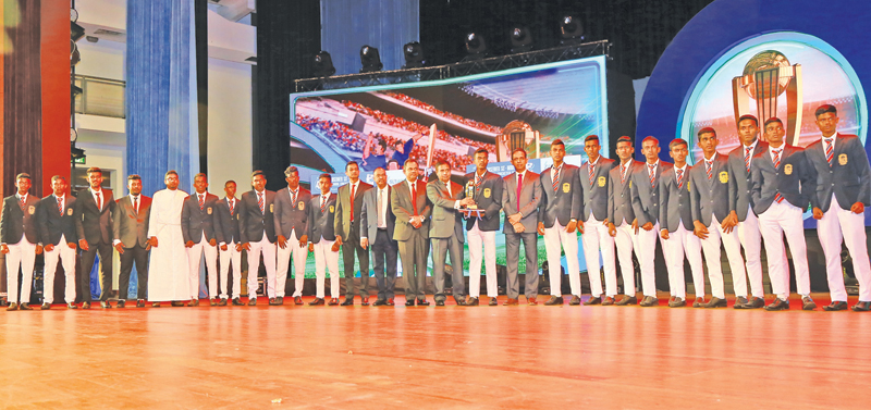 Best school team north western province runner up - A trophy and cash award, St. Sebestian’s College, Katuneriya receving trophy from Director Editorial Sisira Paranathanthri