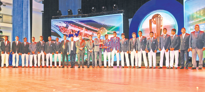 Best School Cricket team from Central Province St. Anthony’s College skipper receiving the award from Director Legal and Administration Janaka Ranatunga