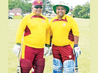 Flashback: Arjuna Ranatunga and his son Dhyan prepare to bat for Ananda in a old boys match against Nalanda in Canada